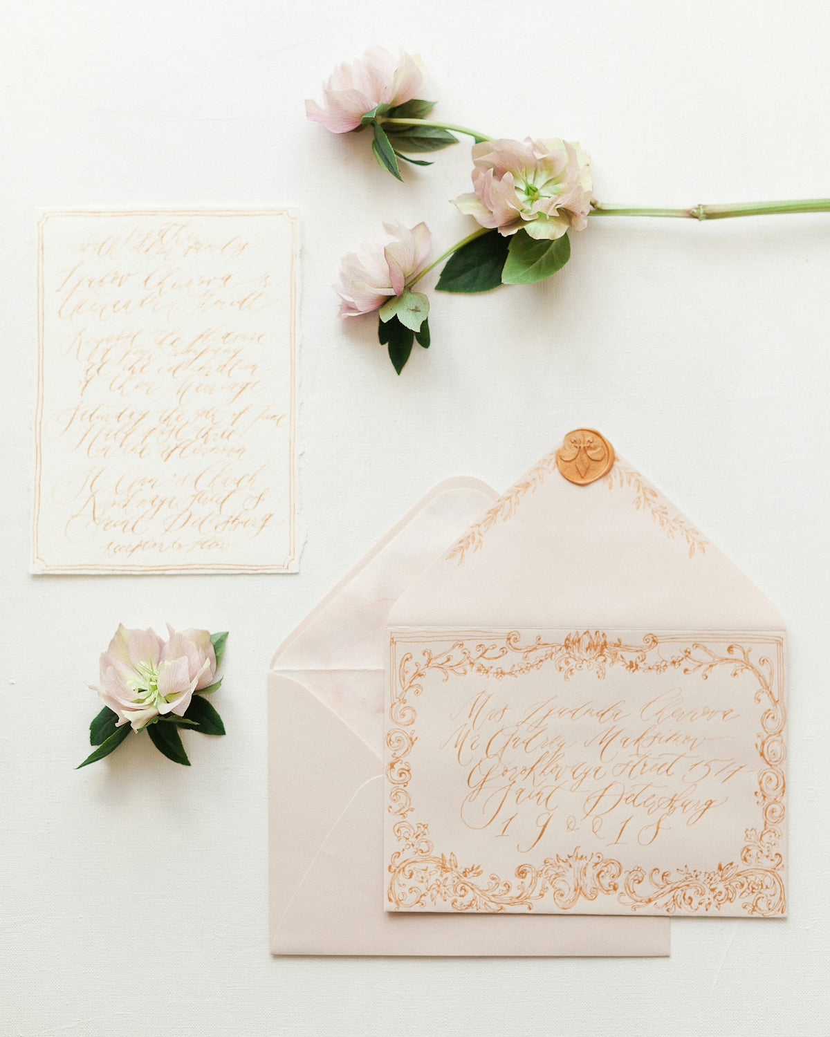a wedding stationery with flowers and calligraphy